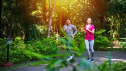 Indian couple doing regular exercise by jogging in park