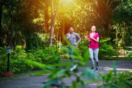 Indian couple doing regular exercise by jogging in park