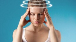 Woman with vertigo. Young patient suffering from dizziness