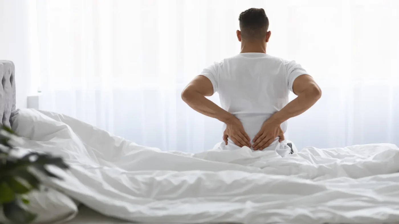 Waking Up With Lower Back Pain: Causes, Sleeping Positions, and Relief